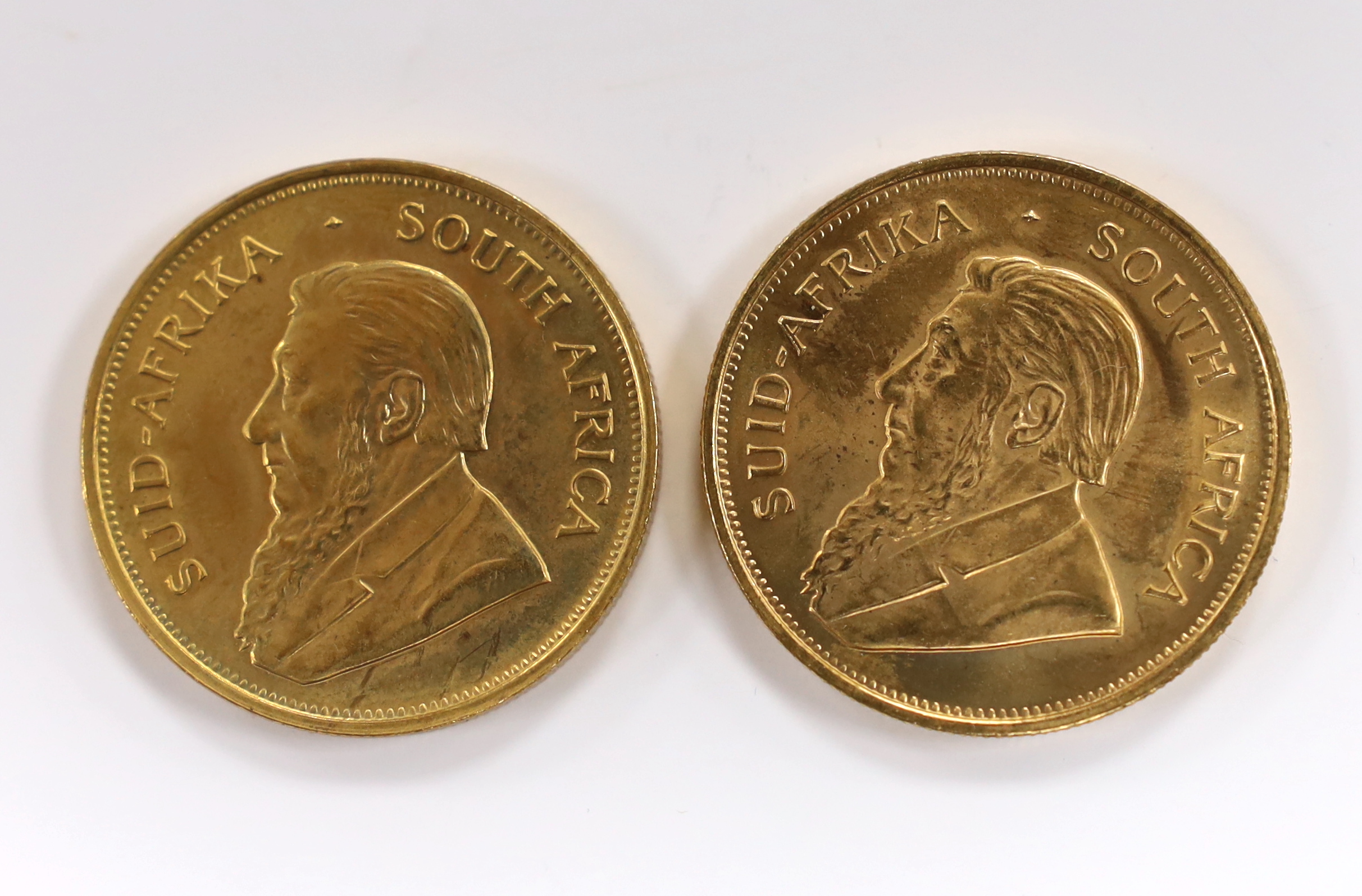 Gold coins, South Africa, two gold 1oz. Krugerrands, 1975, near UNC (2oz.)